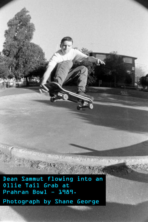 Dean Sammut doing an Ollie Tail Grab - approximately 3 feet in the air above the edge of Prahran Bowl.
      Dean has a look of focus and concentration. The bowl is concrete and there are no other people in the background.
