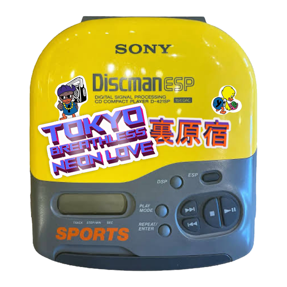 Image of a bright yellow Sony Discman ESP. 
    There are many stickers on the Discman... A TOKYO BREATHLESS NEON LOVE sticker, An Ura Harajuku (Kanji) sticker and two classic World Industries stickers of yellow ducks. 
    One duck is dressed as a rapper with sunglasses, backwards cap, gold chains and an 80s style ghetto blaster.